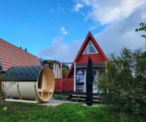 Haus am See mit Fasssauna, Liegewiese und Grill